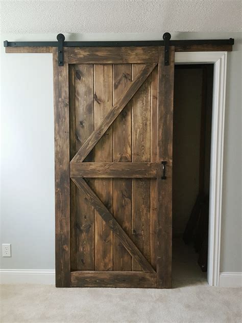 To open, one door panel is slid behind the other panel. Barn Door - Sliding 2 Panel Z Style - Walston Door Company