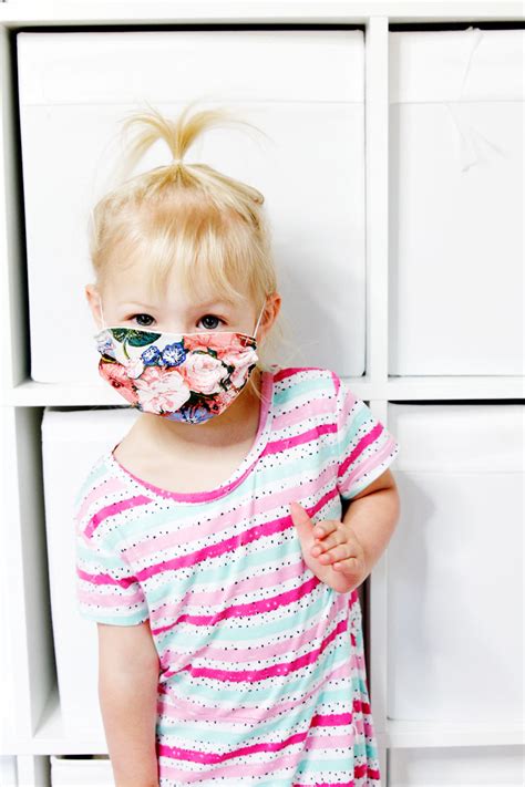 Continue reading for my complete cloth face mask sewing pattern, including tips at the end for how to sew fabric masks with ties instead of elastic loops. How to make a face mask for kids FREE PATTERN - see kate sew