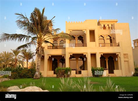The Arabic Style Villa And Palm During Sunset At Luxury Hotel Dubai