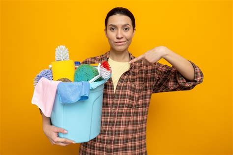 Premium Photo Young Cleaning Woman In Plaid Shirt Holding Bucket With