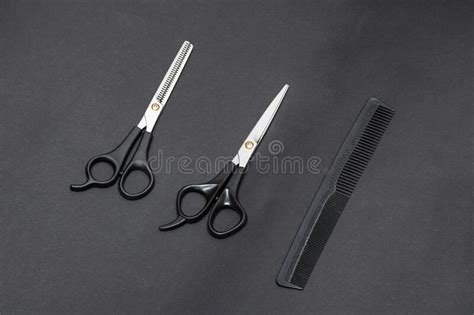 Hairdressing Scissors And Comb On Gray Background Stock Photo Image