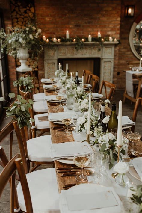 Wooden Trestle Tables With Soft Grey Runners Taper Candles And White