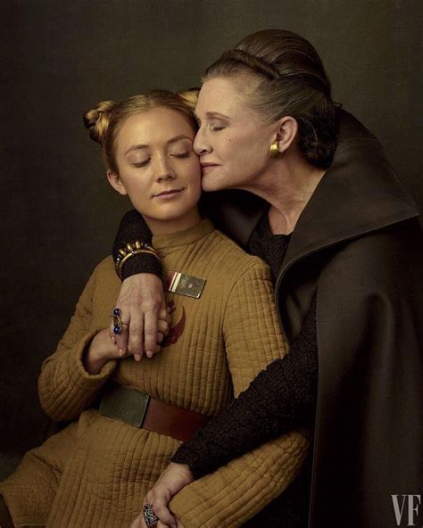 Two Women In Star Wars Costumes Are Touching Each Others Forehead