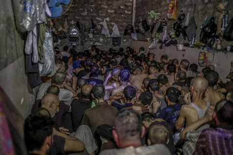 shocking photos emerge of suspected isis fighters held like battery chickens in overcrowded