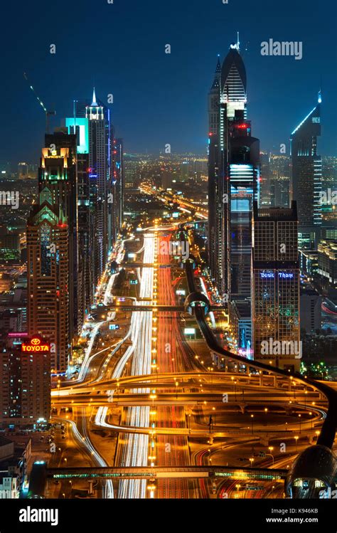 Cityscape With Skyscrapers And Illuminated Road In Dubai United Arab