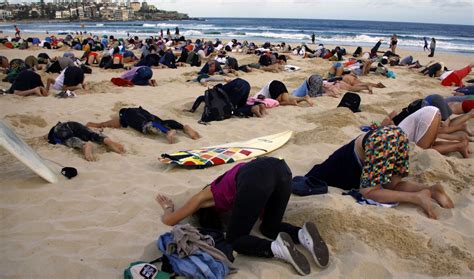 Australian Protesters Bury Their Heads In The Sand For The