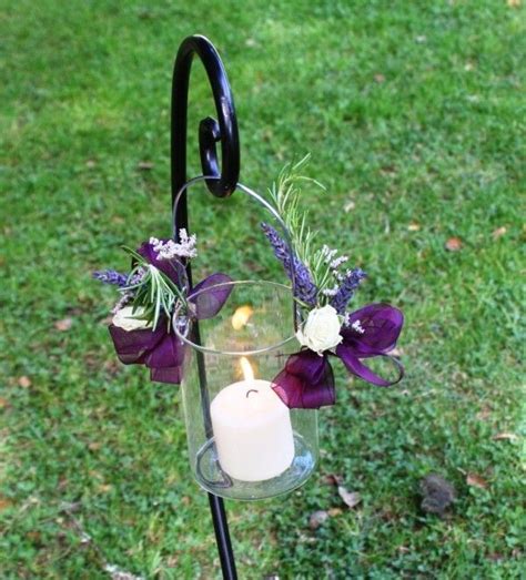 Easily display hanging flower baskets, birdhouses, wind chimes, decorative flags, lanterns, insect control devices and more with the vigoro 84 in. Wedding aisle flowers by Seasonal Celebrations using ...