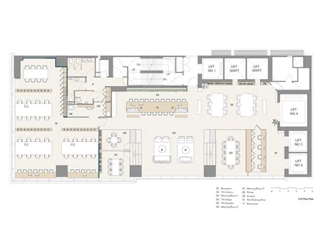 The Floor Plan For An Office Building With Several Tables And Chairs Including Two Desks