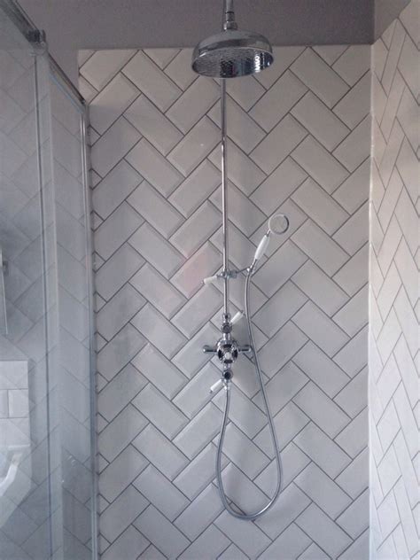 To expand the prominence and presence of your shower, consider installing a subway tile shower surround. Herringbone metro tiles | Traditional bathroom, Beveled ...