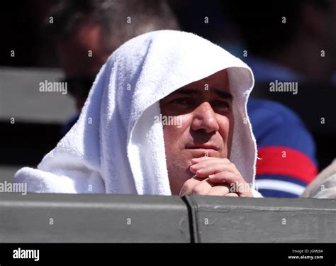 Andre Agassi Uses A Towel To Shield Himself From The Sun On Day Six Of
