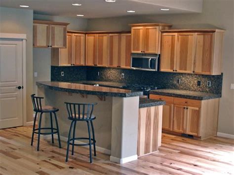 If any of you have these or have considered them, will you let me know whether you are happy with the floors and my cousin did her entire kitchen in hickory and the floors were wide plank hickory. Hickory cabinets with dark tile counters | Hickory kitchen ...