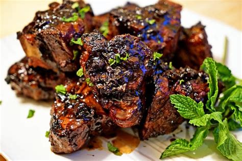 The pork is seasoned, wrapped in bacon, and baked to perfection. Roasted Garlic Balsamic Glazed Lamb Loin Chops - Kevin Is Cooking