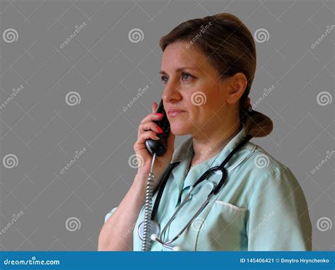 Doctor Or Nurse Call By Phone Woman In Uniform With Handset And