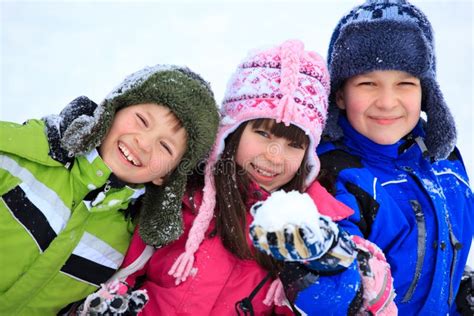 Happy Children Playing In Snow Stock Photo Image Of Female Brothers
