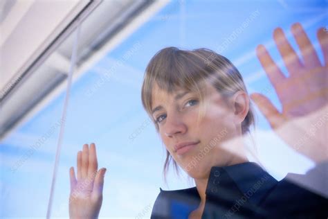 Woman Peering In Through Glass Window Stock Image F0051001 Science Photo Library