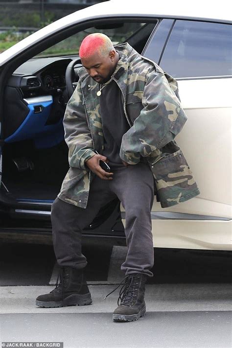 Kanye West Shows Off Rainbow Hairstyle As He Playfully Poses For