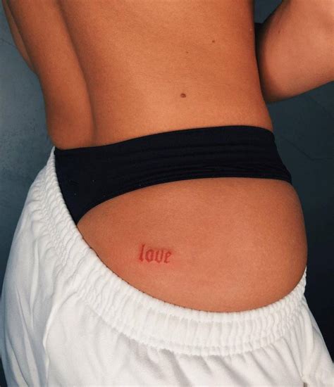 “love” Lettering Tattoo On The Butt Cheek