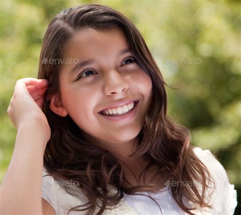 Cute Happy Hispanic Girl In The Park Stock Photo By Andydeanphotog