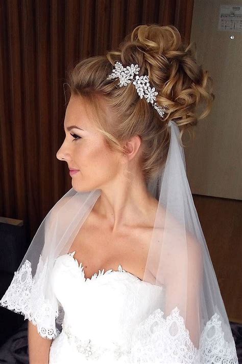 Twist the hair loosely into a bun and twist an elastic around the bun to hold it in place. 36 Wedding Hairstyles With Veil - My Stylish Zoo