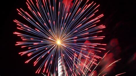 Download Wallpaper 1366x768 Fireworks Sparks Explosion Lights Tablet