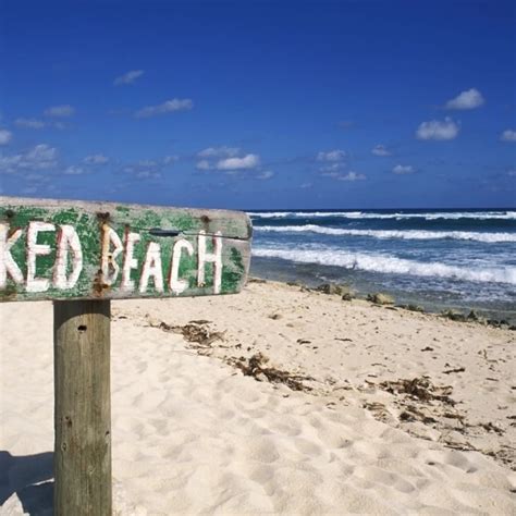 Mexico Yucatan Peninsula Cozumel Naked Beach Sign In Sand Ocean And Blue Sky In Background