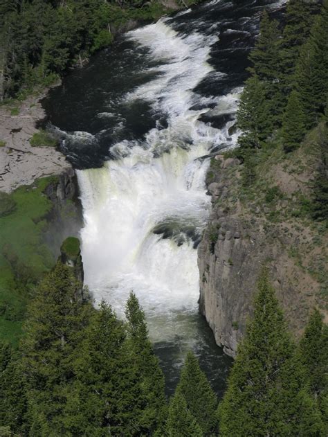 The Lower Mesa Falls Henrys Fork Of The Snake River Plunges Between