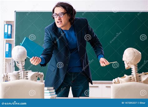 The Male Teacher And Skeleton Student In The Classroom Stock Image
