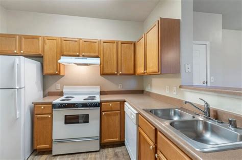 The kitchen, with a breakfast bar, flows into the living area to create an open feeling. Sequoia Park Apartments For Rent in Denton, TX | ForRent.com
