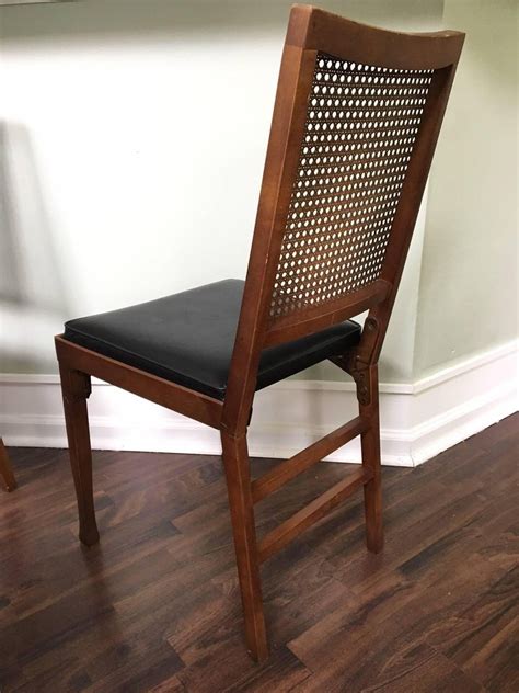 Click 1st photo to supersize all 12 photos. Set of Four Legomatic Cane Back Folding Chairs at 1stdibs