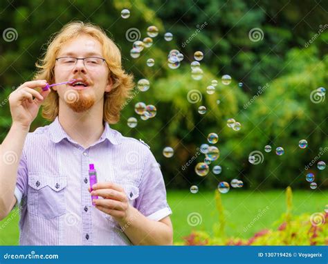 Man Blowing Soap Bubbles Having Fun Stock Photo Image Of Playful