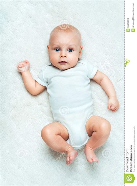 Pretty Baby Is Lying On The Carpet Stock Photo Image Of Newborn Cute
