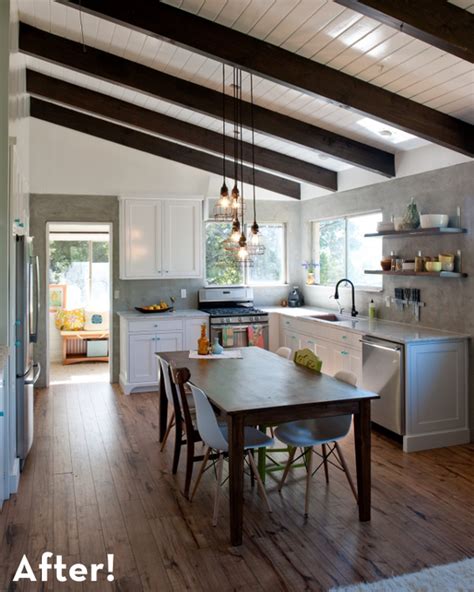 Vaulted ceilings are relics of the old days with a grand allure to them that still manage to thrive in our relatively mundane modern spaces. Rustic modern kitchen remodel. Love the exposed beams, the ...