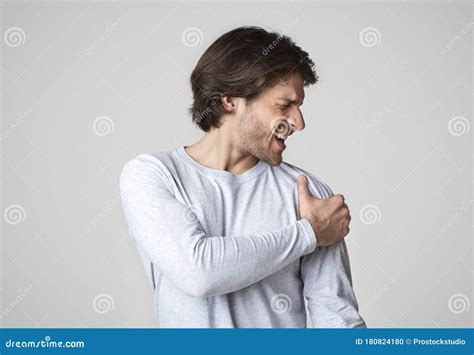 Healthcare Concept Man Suffering From Acute Shoulder Pain Stock Photo