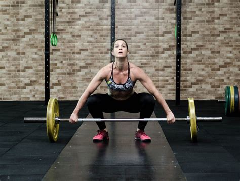 Strong Woman Lifting Heavy Weights