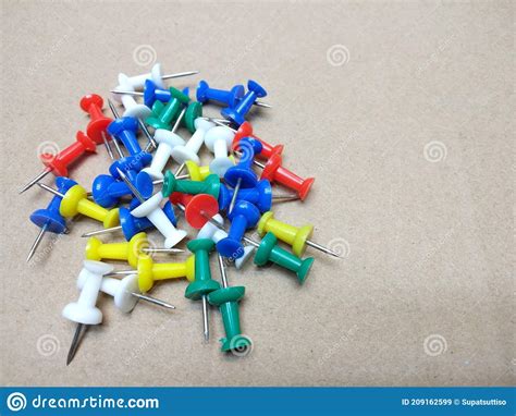 Multi Colored Push Pins With Brown Background Stock Image Image Of
