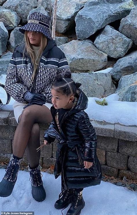 Kylie Jenner Stuns In Head To Toe Dior As She Poses With Her Daughter