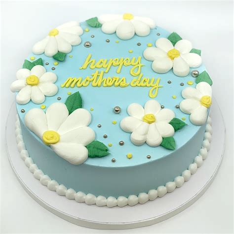 Some buttercreams are used for cake frosting, others for cake icing and some thicker buttercreams recipes are best for piping. Blue Daisy Buttercream Cake | Pastries by Randolph