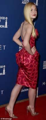 Elle Fanning Rocks A High Fashion Look In A Scarlet Silk Bandeau Dress