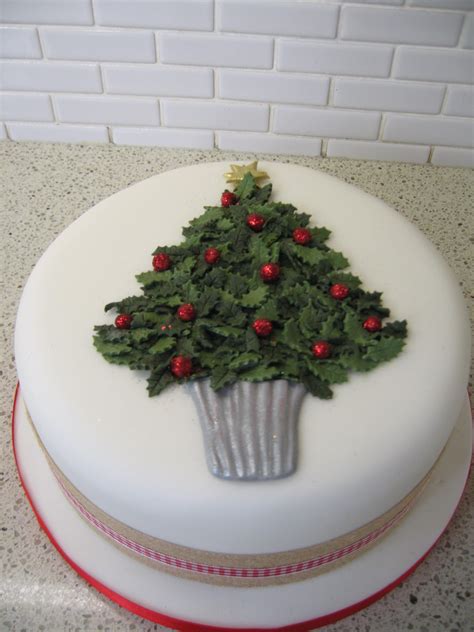 Five simple steps for how to cover your cake in marzipan and royal icing. A holly Christmas tree cake.. | Christmas cake designs ...