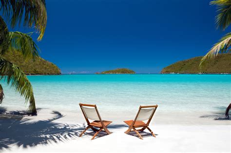 Chairs Between Palm Trees At The Virgin Islands Beach