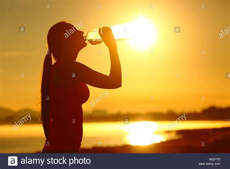 Girl Drinking Water Sunset Silhouette Hi Res Stock Photography And