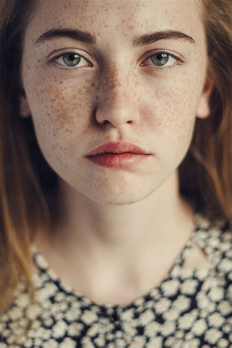 Face Of A Beautiful Girl With Freckles Close-up by Andrei Aleshyn