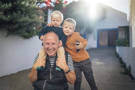 Father With His Two Sons Hugging Each Other Outdoor Stock Image Image