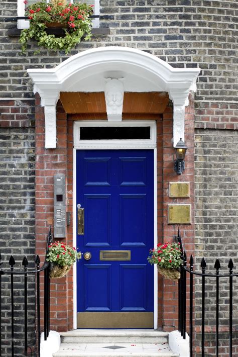 The Facade Of This Home Is Made Out Of Red Brick The Doorway Has Red