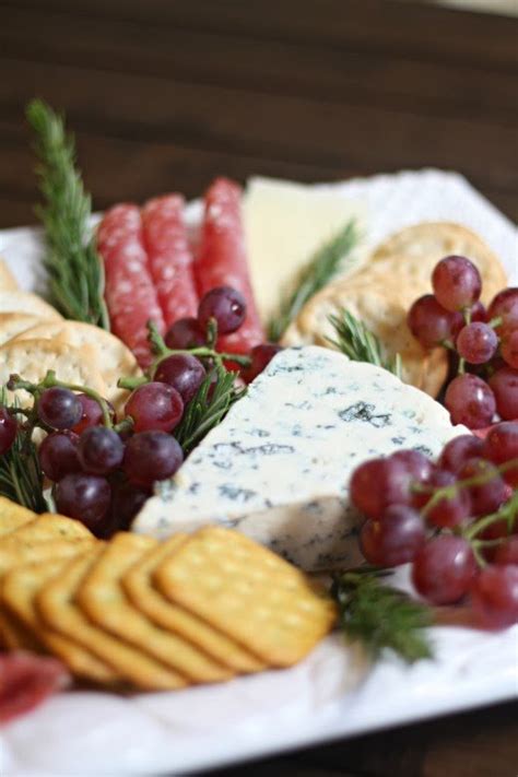 Place the cheese platters and the other nibbles on several tables to avoid guest gridlock. DIY Video Tuorial: Meat & Cheese Platter - A Thoughtful Place