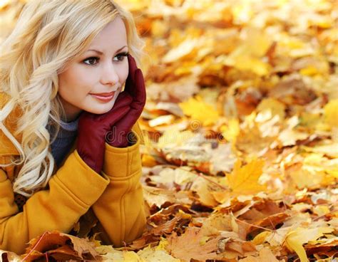 Blonde Girl In Autumn Park With Maple Leaves Fashion Beautiful Stock
