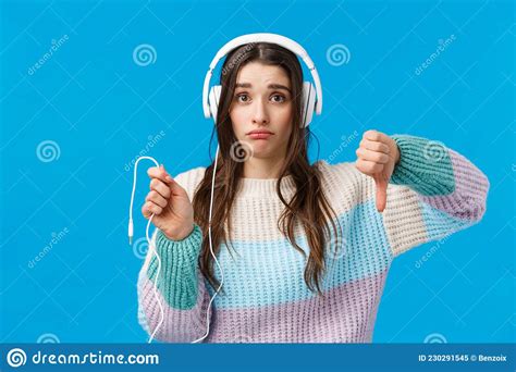 Sad And Displeased Gloomy Cute Brunette Woman In Big Headphones