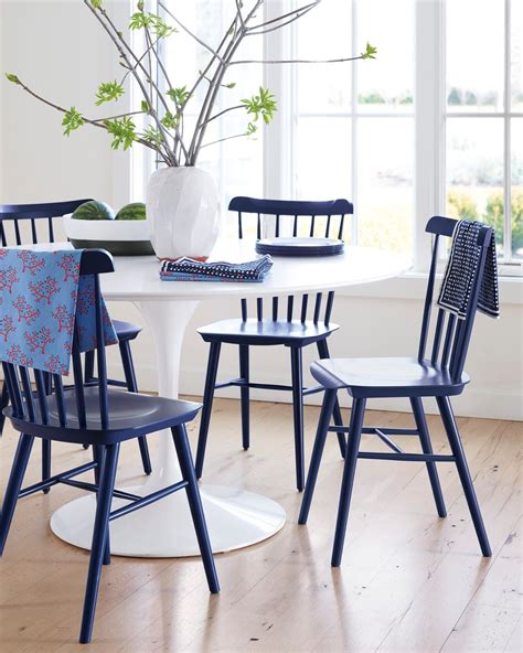 I went through a stage in life where i considered myself an esteemed picnic connoisseur and was if you love the indulgent look of tufted dining room chairs and a french inspired pedestal table, then you'll want to check out today's pottery barn. White tulip table with navy blue chairs // modern coastal dining room | Simple dining chairs ...