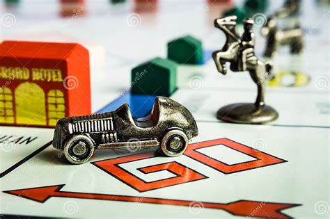Monopoly Board Game Car Token Followed Closely By Other Tokens Editorial Photography Image