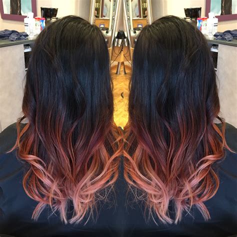 For a subtler take on the rose gold hair color trend, consider coloring your mane in a dark rose gold hue. Black hair and rose gold ombre done by Katie S | Balayage ...